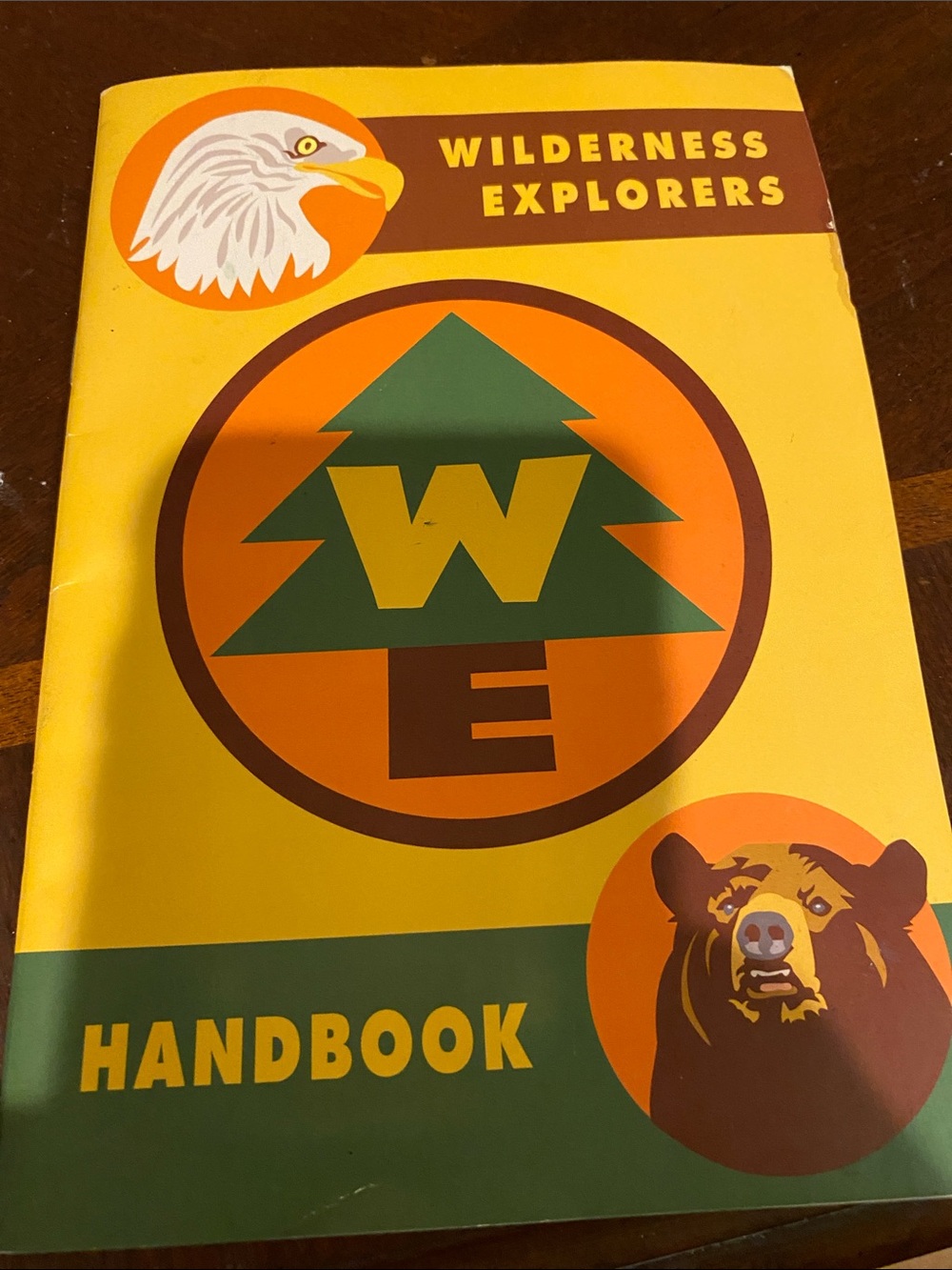 Disney Yellow Wilderness Explorers Handbook with Green and Orange Accents